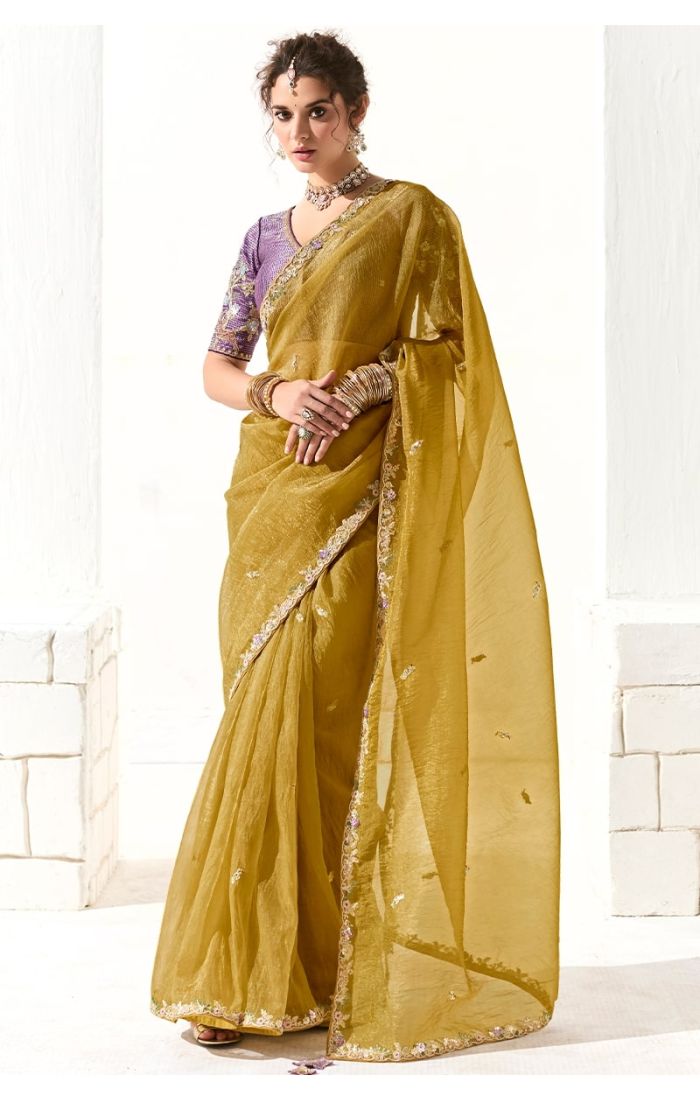  Front view of mustard organza saree with embroidered blouse for wedding