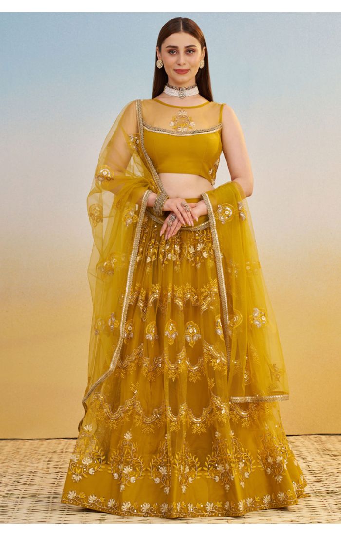 Mustard yellow embroidered net lehenga with sequins and zari — full front view, elegant party or wedding outfit, Appelle Fashion.