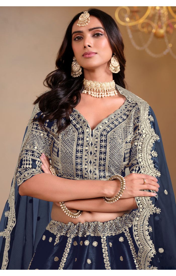 Close-up of blouse embroidery in navy blue lehenga from Appelle Fashion