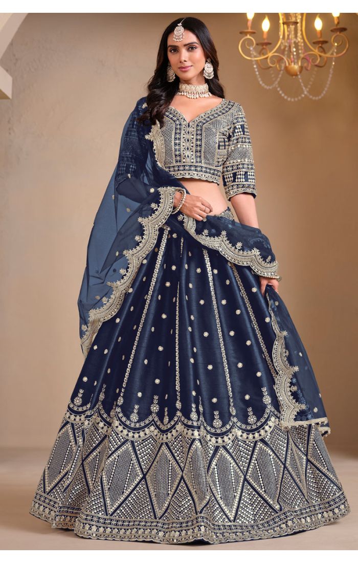 Model wearing navy blue art silk lehenga with mirror embroidery – full view