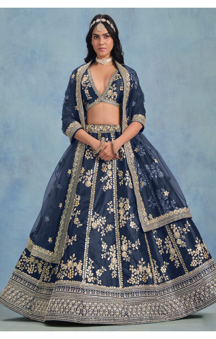 Side profile of navy lehenga showing detailed border and mirror work