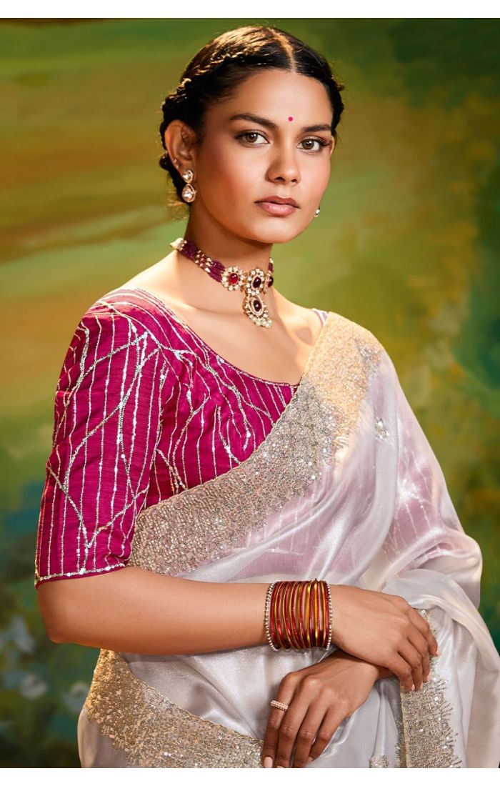 Close-up of zari, sequin, resham embroidery on off white saree