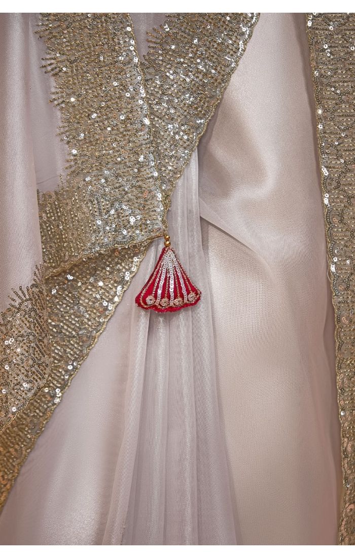  Detailed view of embroidery and stone work on off white organza saree