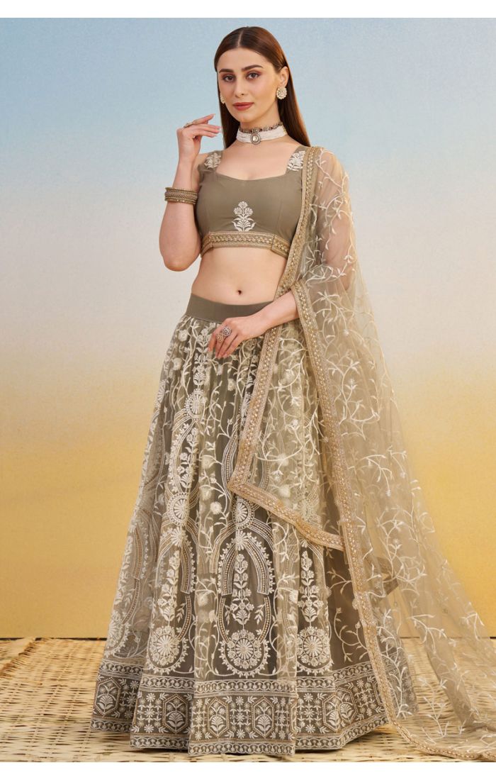 Detailed view of olive green lehenga blouse with thread zari embroidery and sheer net dupatta, premium festive outfit.
