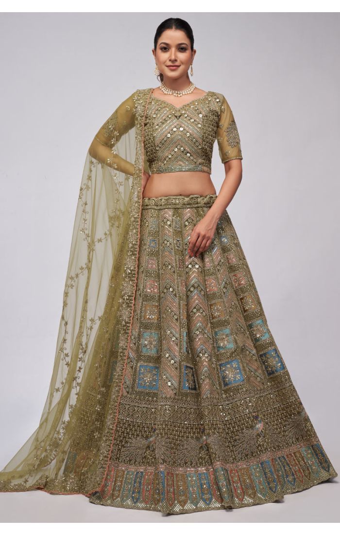 Olive green hand-embroidered net designer lehenga choli with peacock motifs and intricate chevron-pattern embroidery. Perfect for weddings and celebrations.