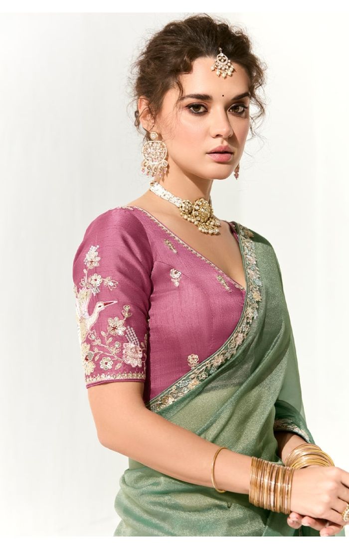 Side front look of the model in green saree and heavy jewellery – elegant Indian saree UK