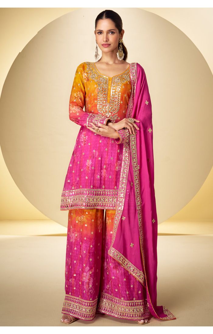 Pakistani georgette suit in pink-orange with long sleeves and scoop neck – front view