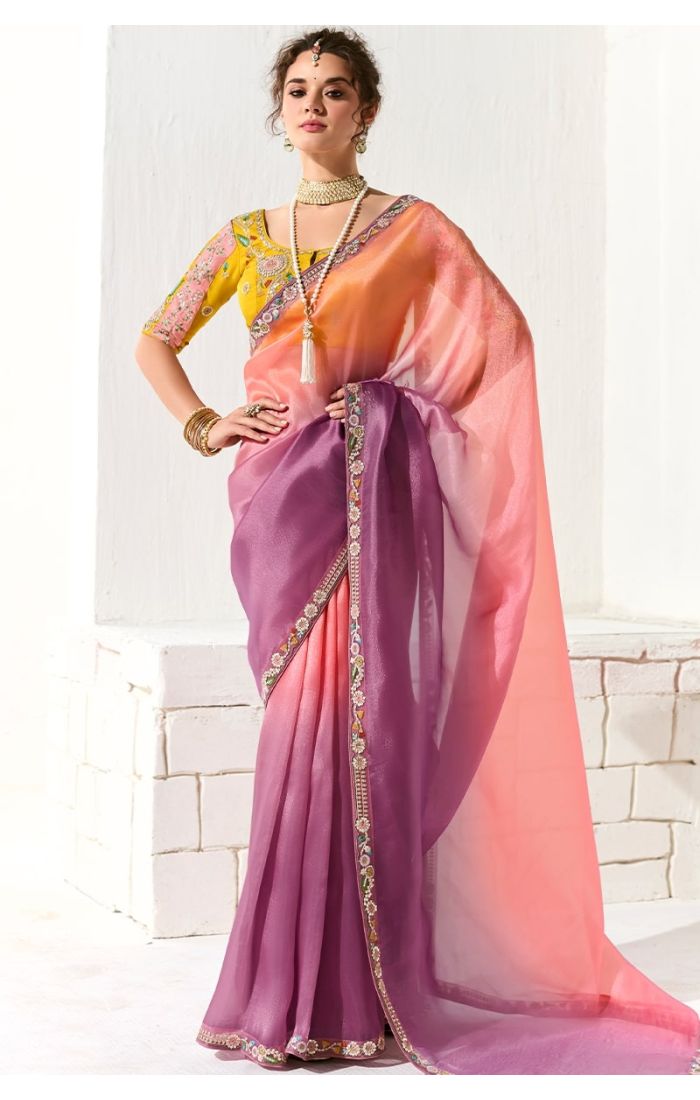 Full view of peach-purple shaded organza saree with embroidered yellow blouse – front pose.