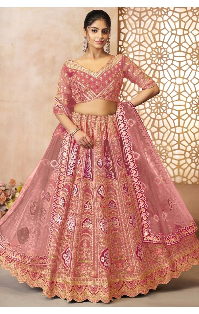 Full front view of pink aari embroidered bridal lehenga with net dupatta