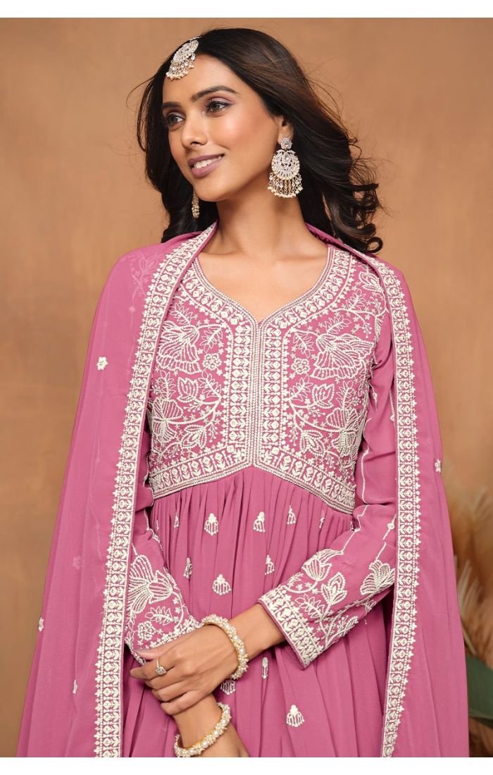 Close-up of embroidered yoke and neck detailing on pink sharara suit.