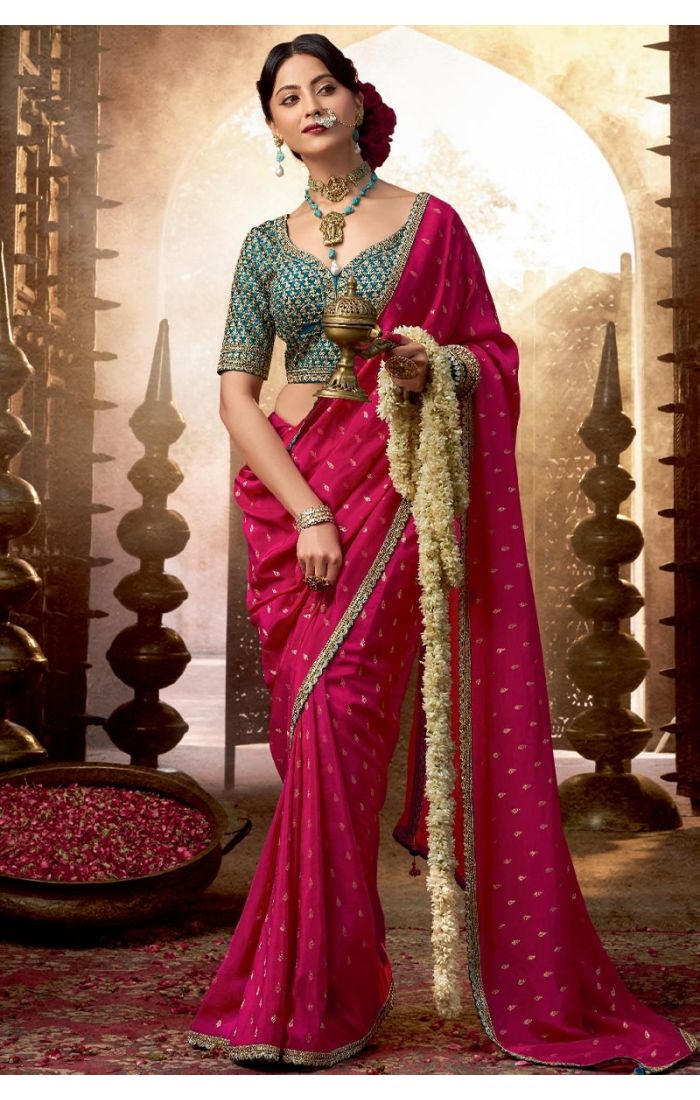 Full view of pink viscose crepe saree with zari embroidery and lace border