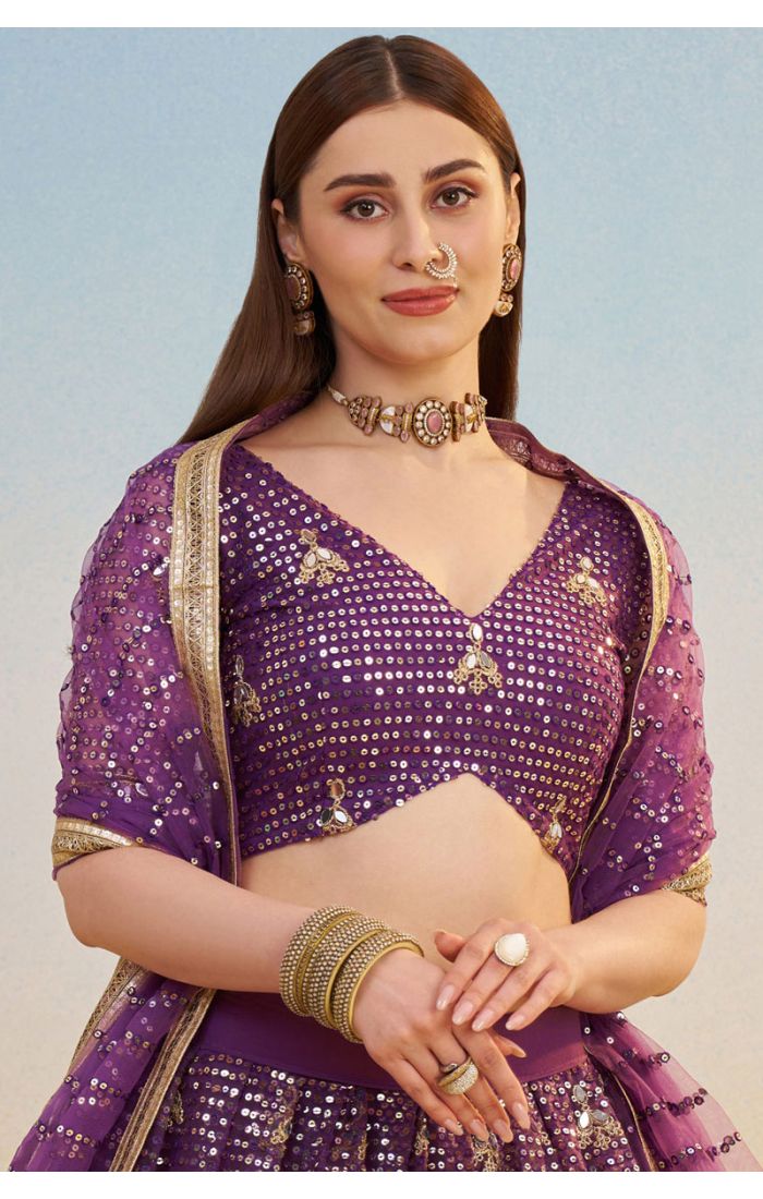 Close-up of purple sequin embroidered blouse and net lehenga skirt, modern designer ethnic couture by Appelle Fashion.