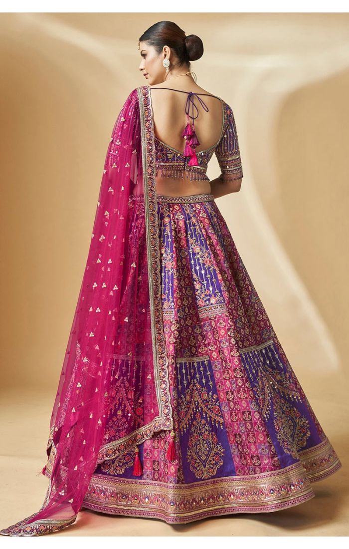 Purple bridal lehenga choli with embroidered net dupatta – back view