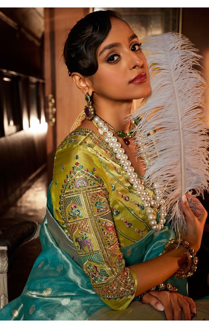 Close-up of zari and stone embellished border on tissue silk fabric