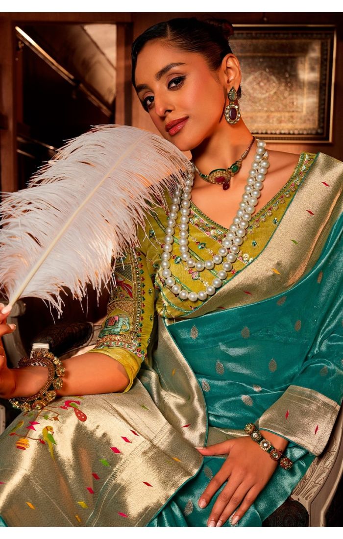 Model styled in Rama blue Paithani saree for wedding function