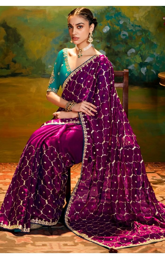 Sitting Detailed pallu and border embroidery of rani pink saree