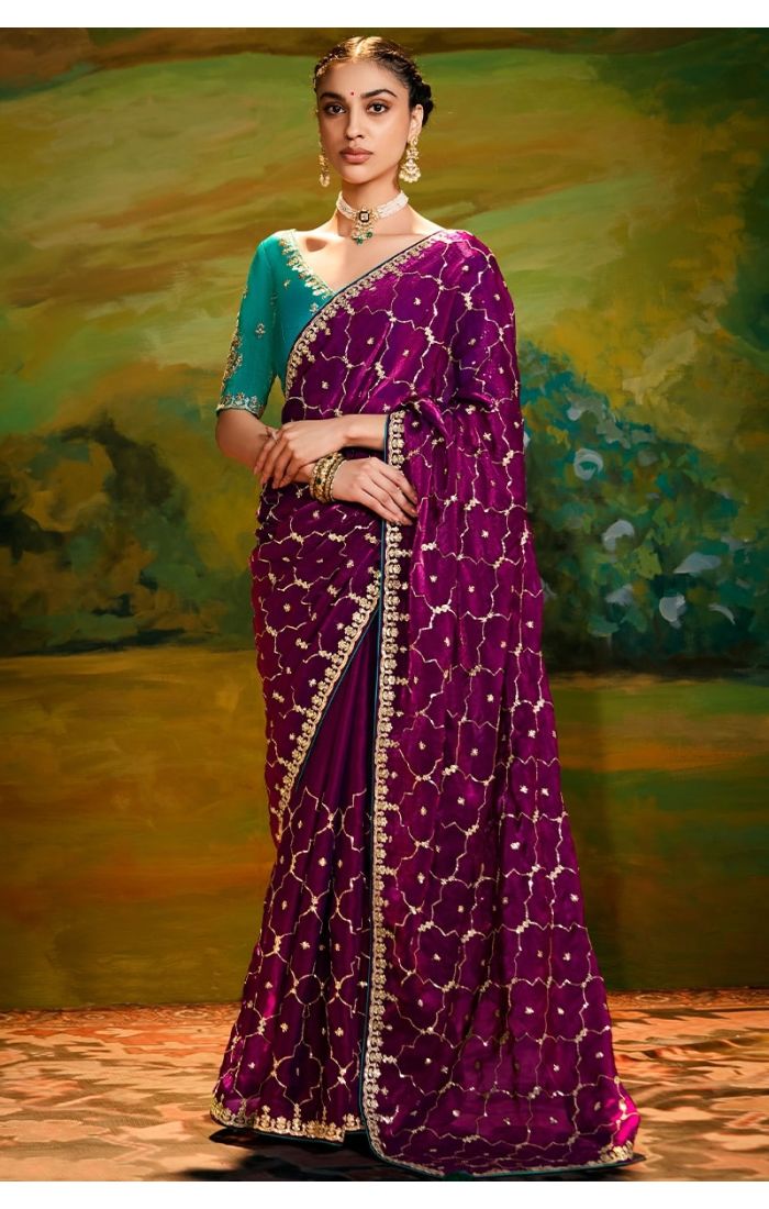 Rani pink organza saree front view with rama green raw silk blouse