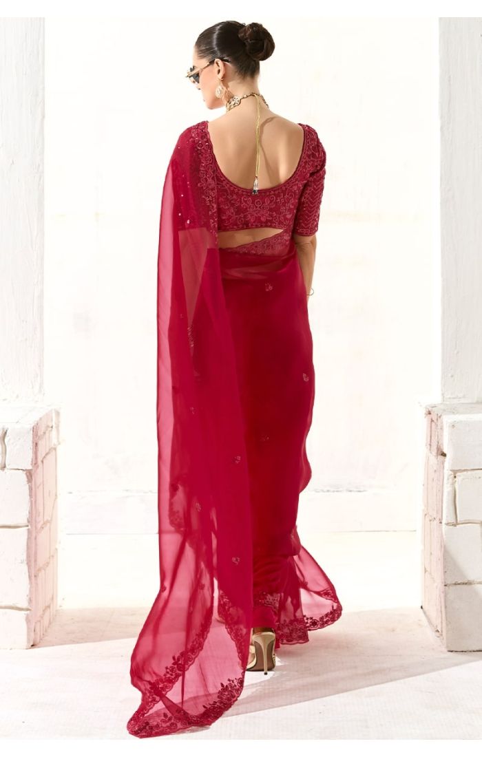  Back view of rani pink saree showing blouse embroidery and drape