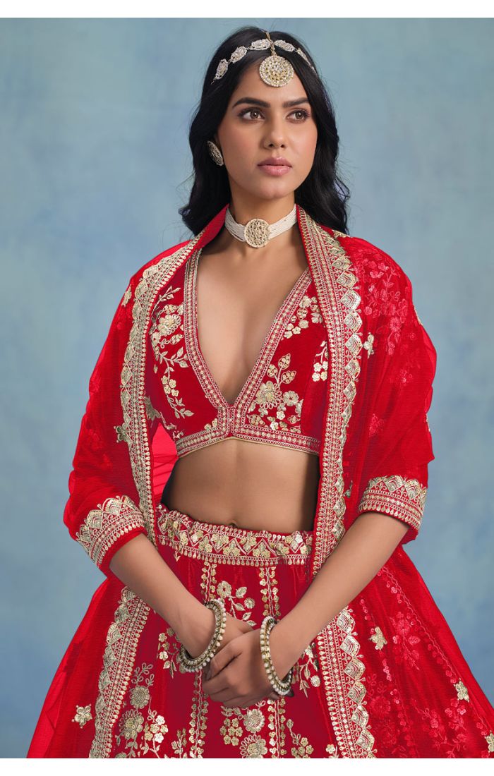 Red art silk lehenga with deep V-neck embroidered blouse – close-up view