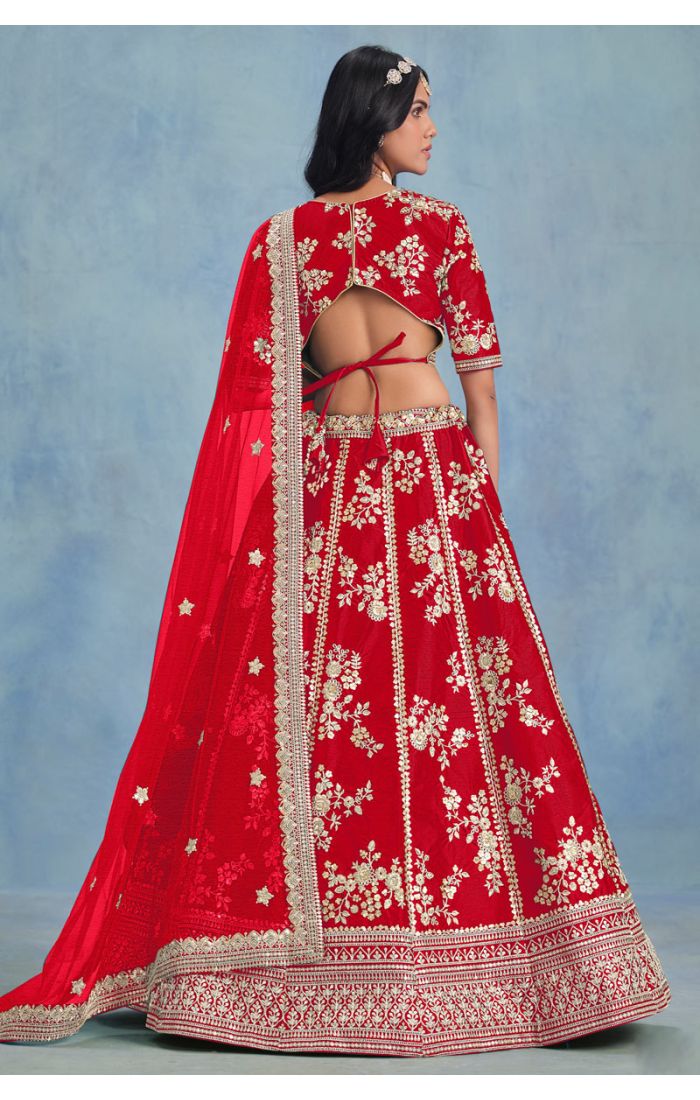 Red art silk lehenga with deep V-neck embroidered blouse – close-up view