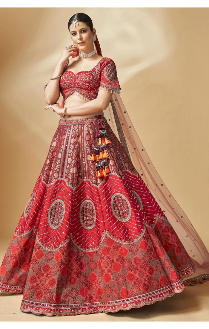 Red bridal lehenga choli with peach net dupatta styling