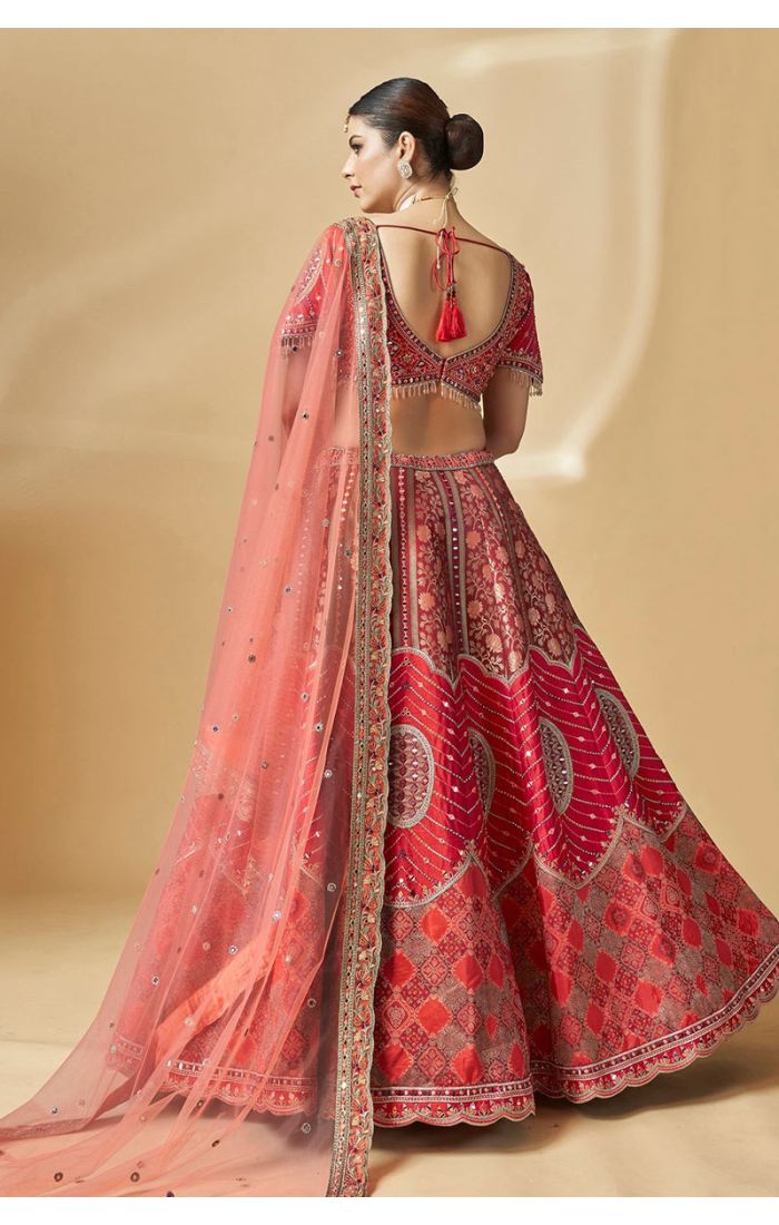 Back view of red silk bridal lehenga choli with tassel tie-up