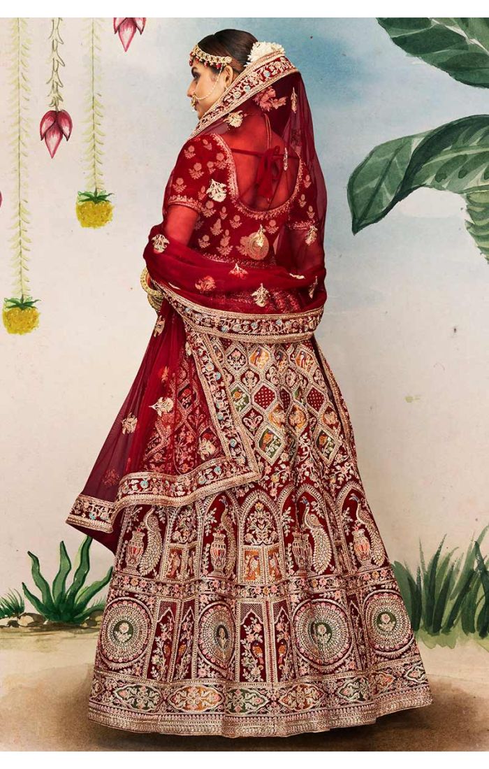 Detailed view of red velvet round neck blouse and embroidered dupatta with intricate temple-inspired motifs, premium bridal fashion.
