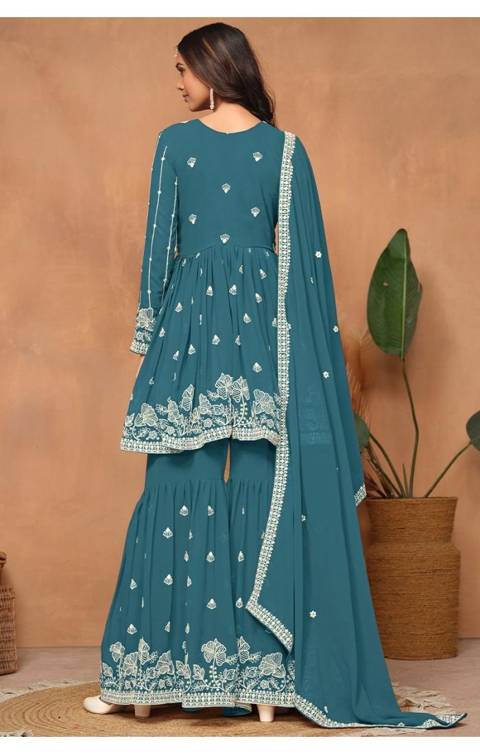 Back profile showcasing flared sharara pants and intricate sequin work.