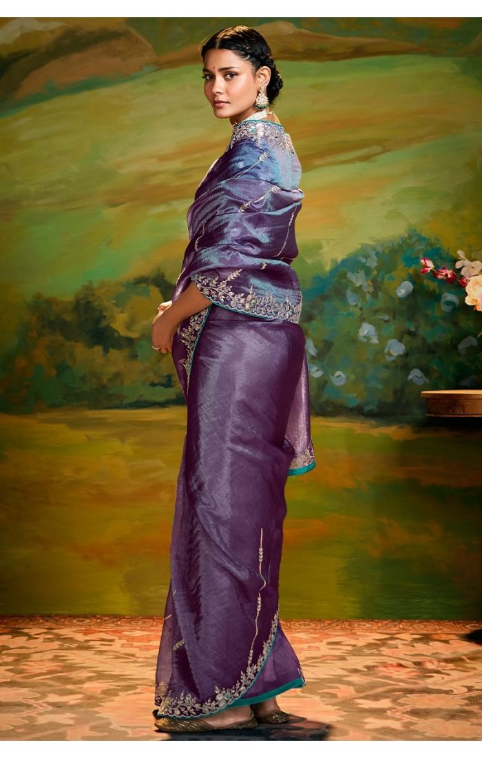  Side drape view highlighting intricate sequins and stone work on purple saree