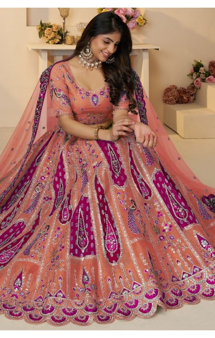 Elegant Sitting Pose – Soft Net Bridal Lehenga with Peacock Work