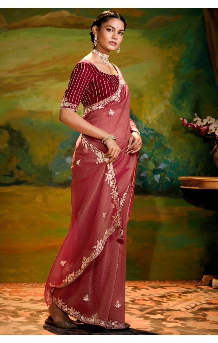 Side view Detailed shot of zari, sequins, resham, and stone work on saree
