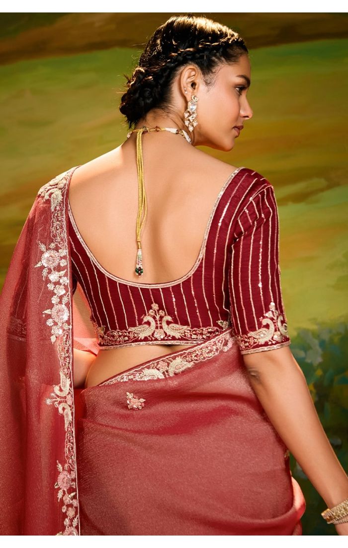 Back view showing maroon blouse and saree pallu details