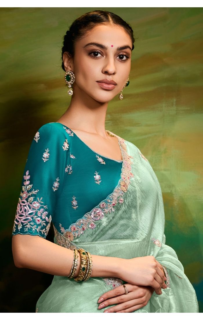  Detailed close-up of zari, sequin, resham, and stone work on saree