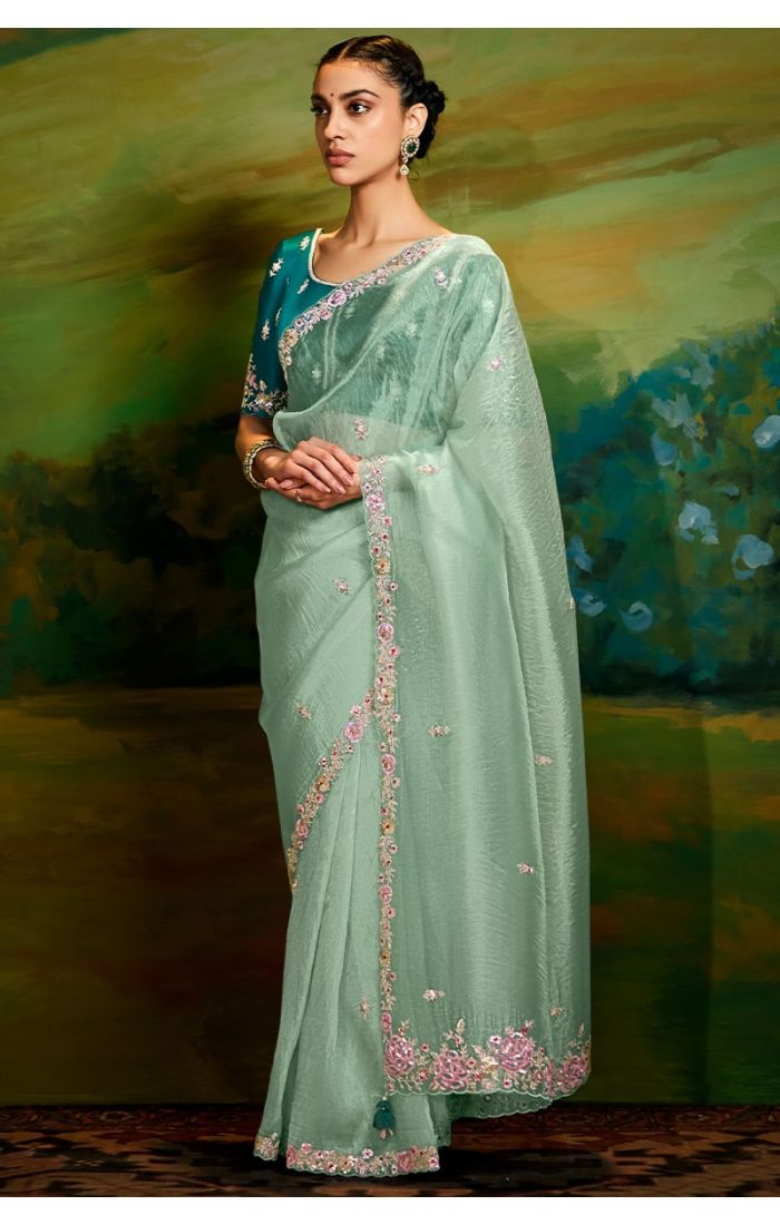 Sea green organza saree front view with rama blue raw silk blouse