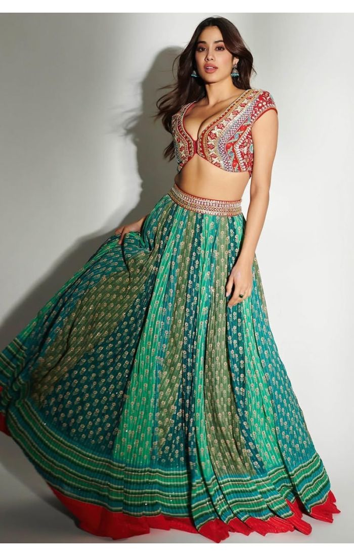 Designer festive lehenga with vibrant green flared skirt and intricately embroidered red blouse for women.