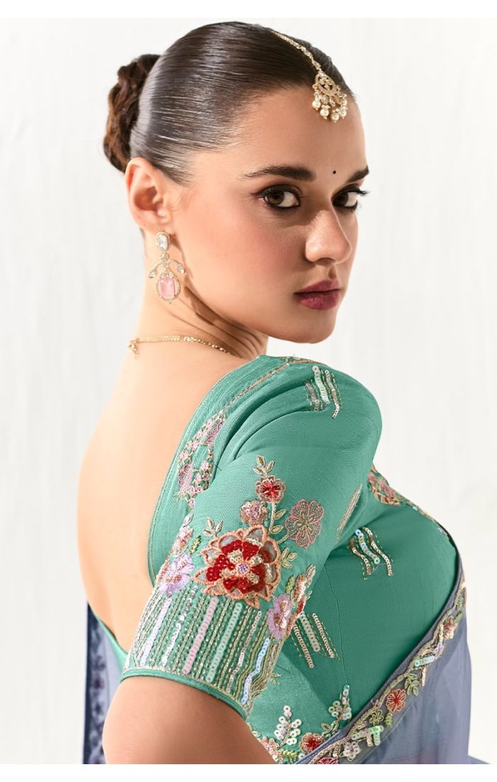 Detailed view of green pure silk embroidered blouse with floral stone work