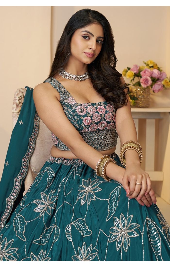 Close-up of blouse detailing on teal sequin bridesmaid lehenga