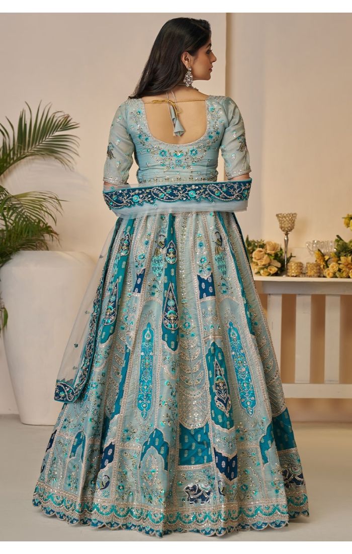  Back view of mustard Rajsi bridal lehenga with zari patchwork and elephant embroidery