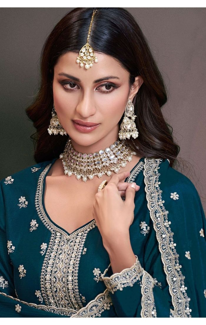 Close-up of designer embroidery and neckline on teal blue Chinon salwar suit