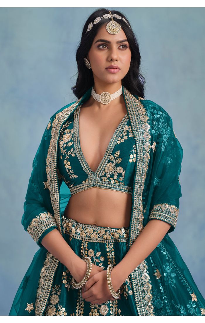 Close-up of blouse detailing on teal green bridal lehenga – LEHV4096