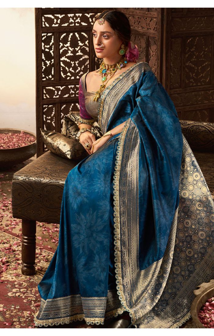 Side profile of teal party function saree with intricate pallu design