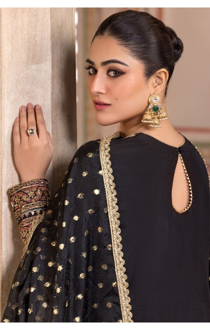 Back profile view of Black Silk Blend Embroidered Salwar Suit with golden dupatta and intricate sleeve detailing.
