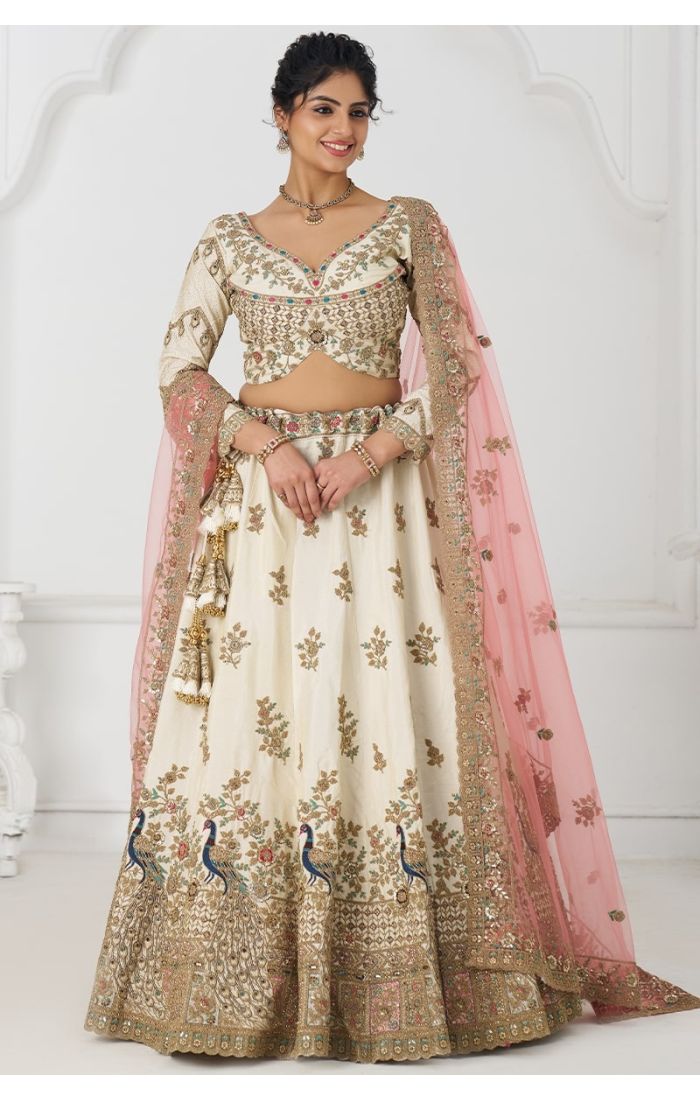 Full front view of ivory designer bridal lehenga with detailed blouse