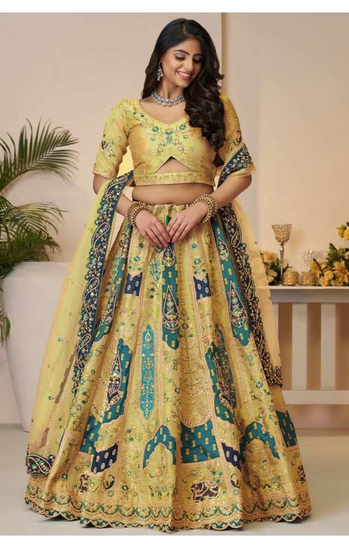  Front view of yellow embroidered lehenga with elegant blouse