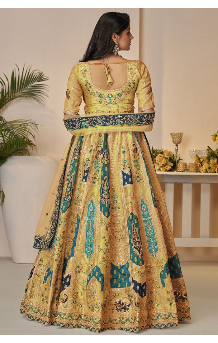 Back view of yellow Banarasi lehenga with detailed embroidery and dupatta
