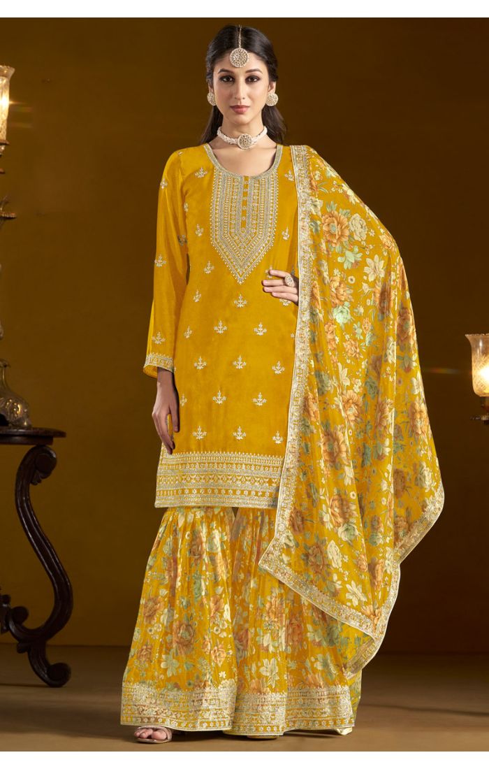 Model in yellow art silk salwar kameez with intricate embroidery – SALV5734