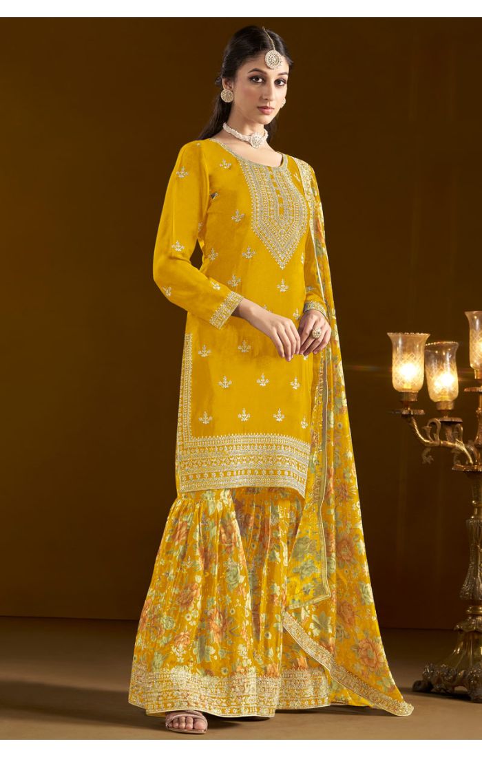Model in yellow art silk salwar kameez with intricate embroidery – SALV5734
