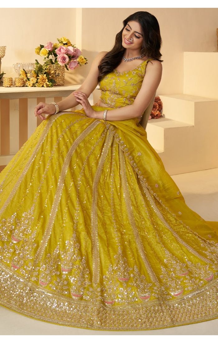 Bride twirling in yellow cut dana sequin lehenga – haldi ceremony lehenga for Canada