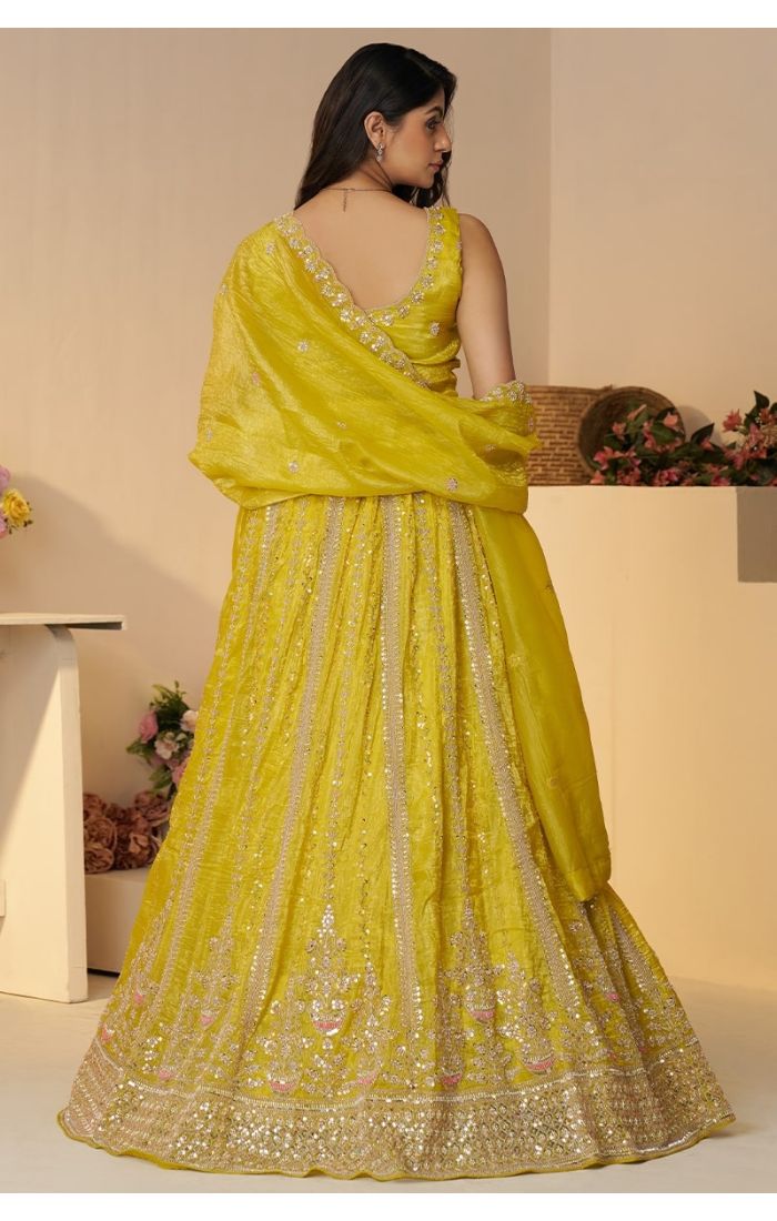 Back view of vibrant yellow sequin cut dana lehenga with dupatta – haldi bridal lehenga for USA market
