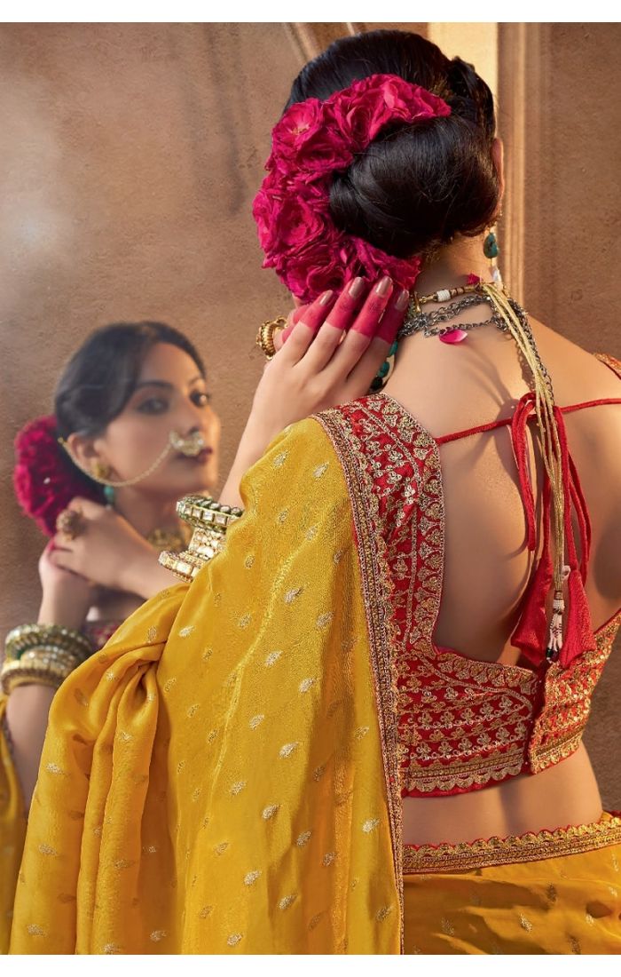 back view of Pure silk yellow blouse with rich embroidery detail